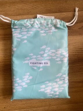NWT. Fighting Eel Beach Towel Aqua in  Mint Drawstring Bag with White Fish Print